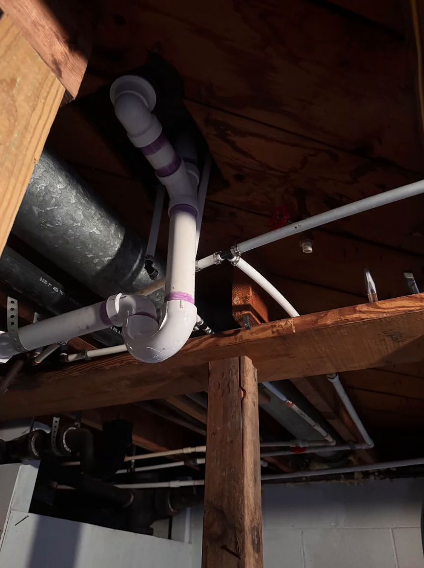 PVC drain lines under floor joists